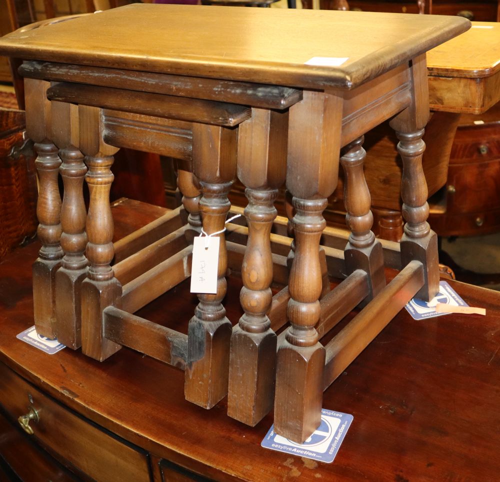 A nest of three oak tea tables, W.60cm, D.22cm, H.46cm